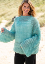 Løs sweater med patentstriber